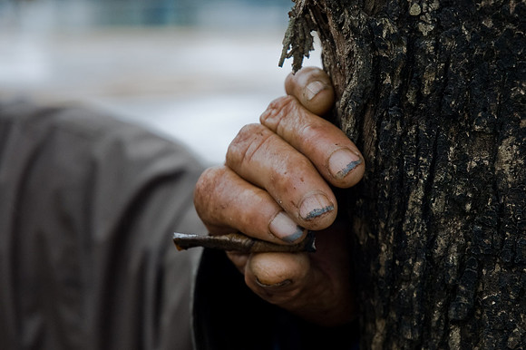 Old hand with cigar